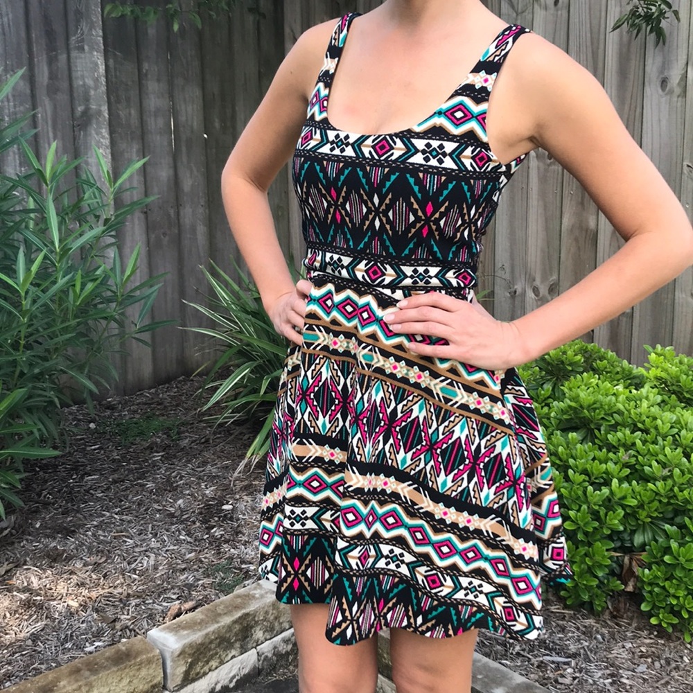 Pink, teal, and black patterned dress.